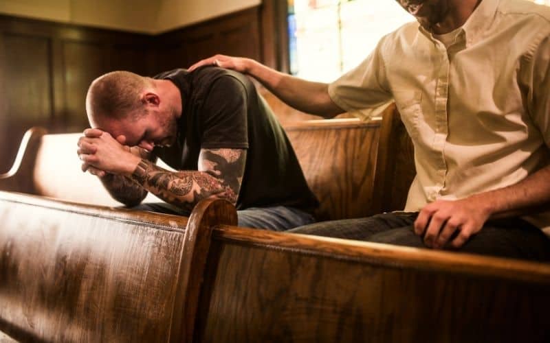 man praying for a man - what do deacons do